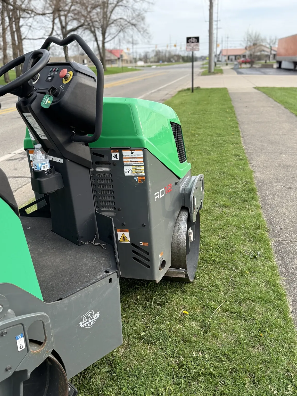Forge vibratory lawn roller alongside a maintained commercial lawn